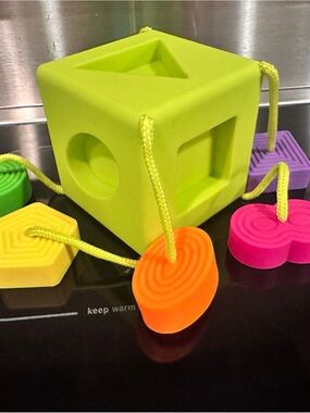 Fat Brain Colorful Lime Green Shape Sorting Cube with Multicolor Lacing Pieces